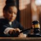 Court of Law Trial in Session: Honorable Female Judge Pronouncing Sentence, striking Gavel. Focus on Mallet, Hammer. Cinematic Shot of Dramatic Not Guilty Verdict. Close-up Shot.